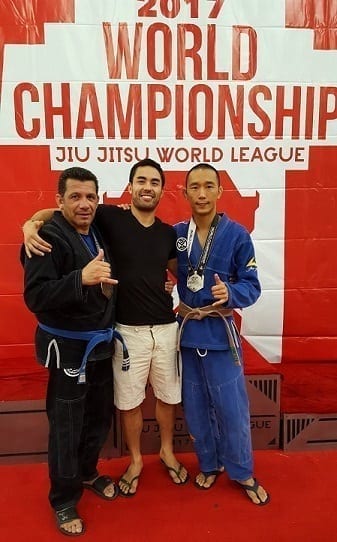 Police Officer Chris at the Jiu-Jitsu World League World Championship with Professor Gino and David Yu receiving his medal