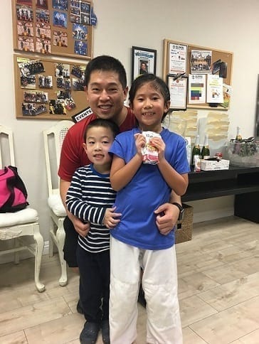 BJJ kids student Sammi with her dad and brother after Jiu-Jitsu class