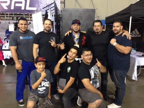 BJJ adult student Ismael Aguila with his family after taking gold medal at IBJJF World Championships