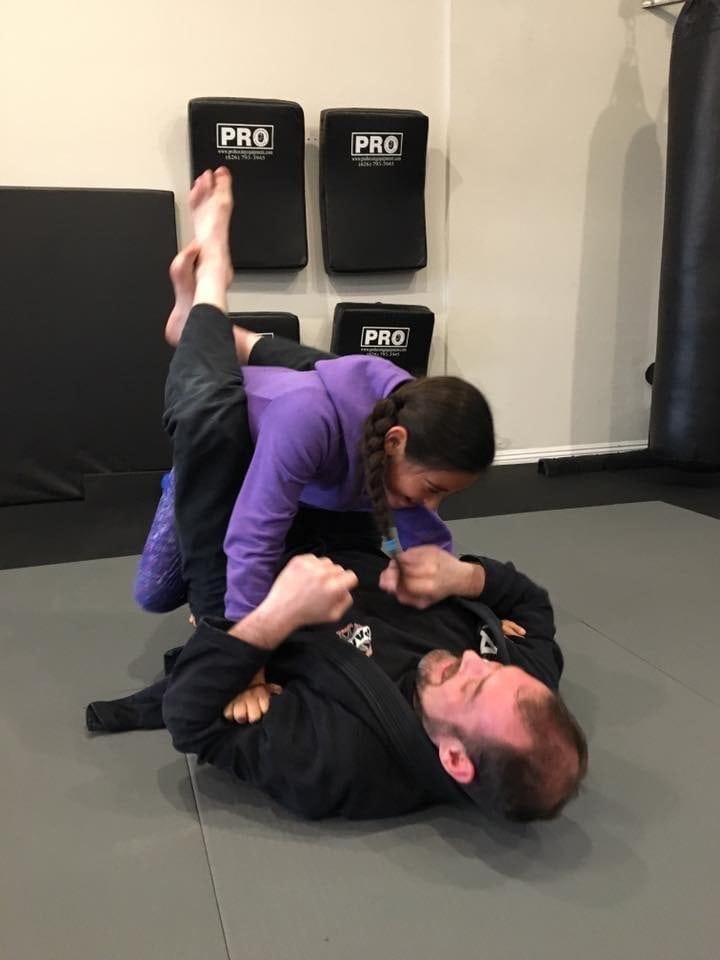 Monty Martin training BJJ with kid Ally