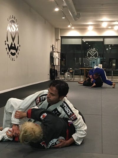 Mike rolling sparring Jiu-Jitsu with Jackie in adult All Levels class