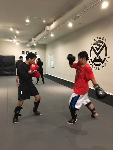 Mike Delgado sparring in Muay Thai Dutch Kickboxing class