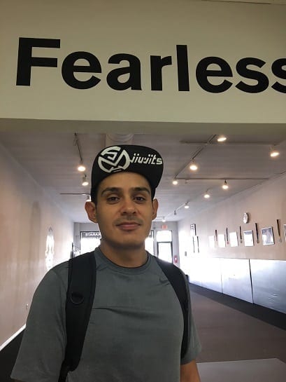 BJJ Student Antonio with Silanoe Martial Arts custom hat in mat opening